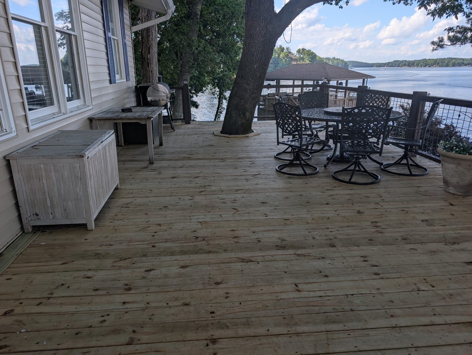 Rebuilt lakefront deck with patio furniture