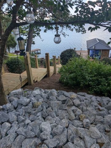 Wood walkway beside rock shoreline protection